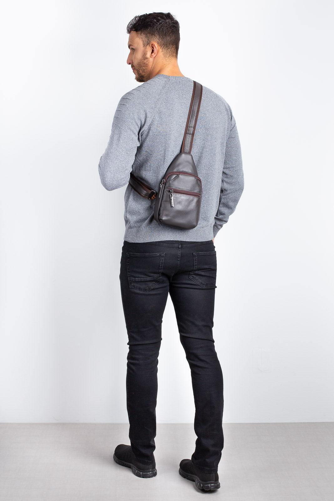 Mini mochila transversal de couro Jeff