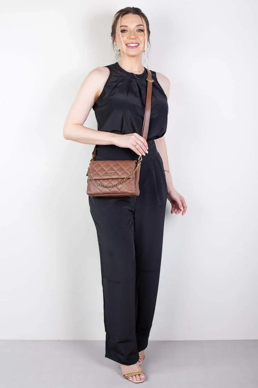 Bolsa de couro com corrente matelassê Giulia - Enluaze