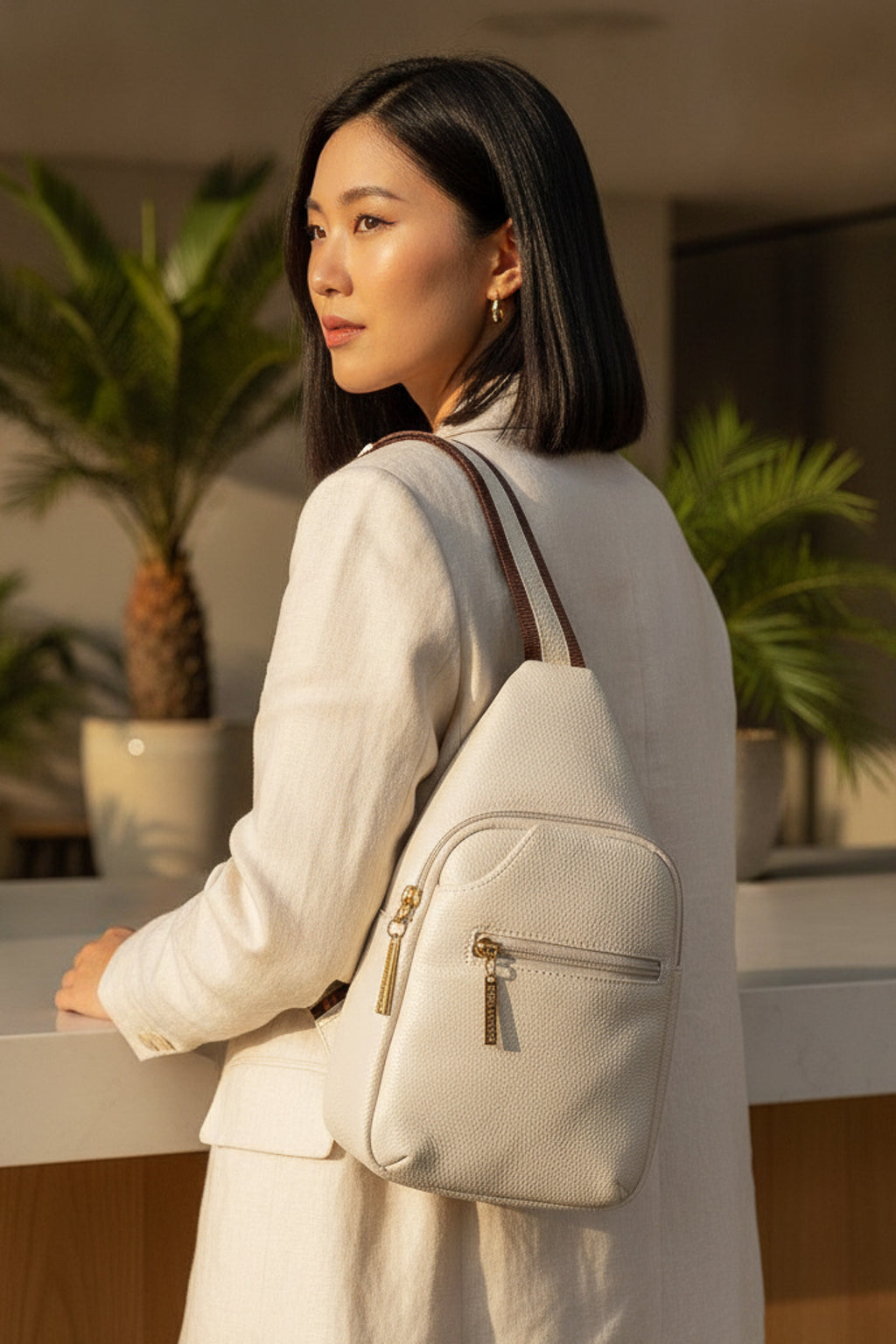 Mini mochila feminina transversal de couro liso Jenny